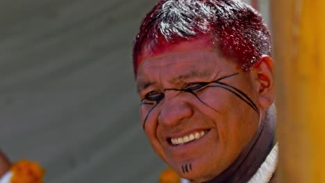 A-native-Amazon-man-with-dyed-red-hair-and-facial-painting