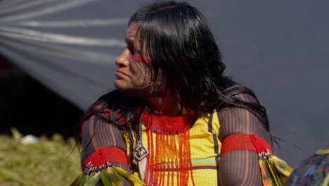 An-indigenous-traditionally-tattooed-woman-in-colorful-dress-during-the-COP-30-march