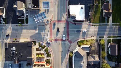 aerial-timelapse-of-a-busy-suburban-intersection-at-sunset