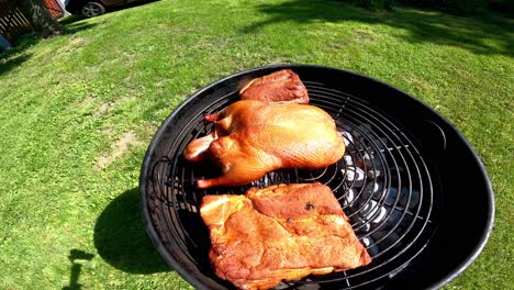Roast-duck-and-pork-on-the-grill-on-a-summer-day