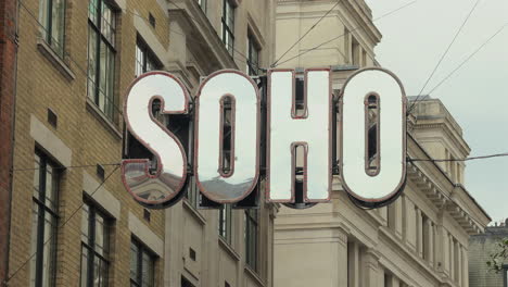 Close-up-of-Soho-sign-above-Beak-Street,-London,-Day