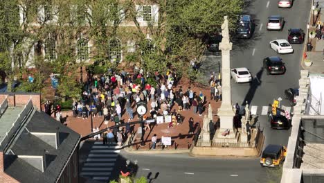 Approaching-drone-shot-of-protester-in-front-of-Christian-school-during-event