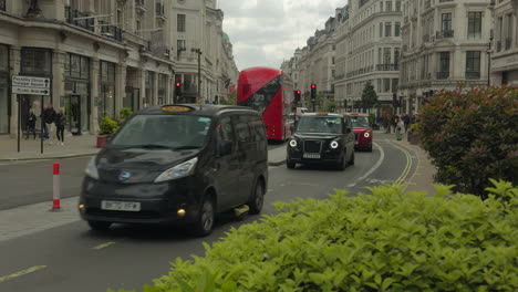 London-Taxis-drive-down-Regents-Street-toewards-Oxford-Circus---Day