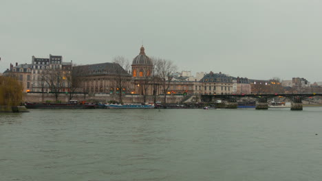 Wide-angle-view-of-Pont-Des-Arts-with-waterfront-in-Paris,-France