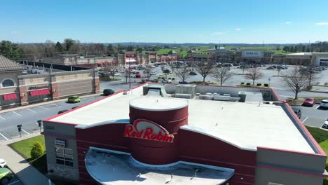 Rising-drone-of-Red-Robin-Restaurant-in-American-during-sunny-day