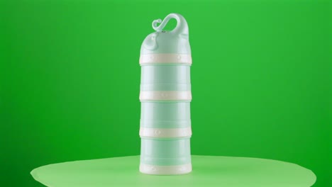 Baby-formula-milk-dispenser-dosis-dosifier-elephant-shape-in-a-turntable-with-green-screen-for-background-removal-3d