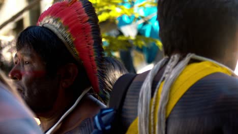 Close-up-of-the-head-and-face-of-an-indigenous-amazonian-man-with-colorful-headdress