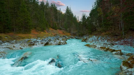 Mountain-river-Rissach-in-Austrian-alps,-with-vibrant-sky