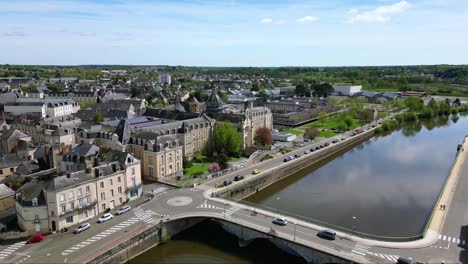 Chateau-Gontier-hospital-in-background-with-Mayenne-River-and-bridge,-France