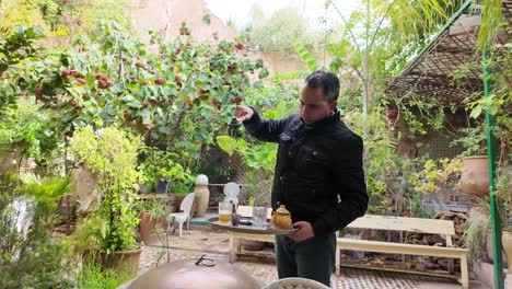 Traditional-way-of-pouring-serving-mint-tea-chic-coffee-shop-Fes-Morocco