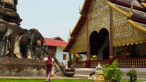 Brunette-woman-exploring-buddhist-Wat-Chiang-Man-temple