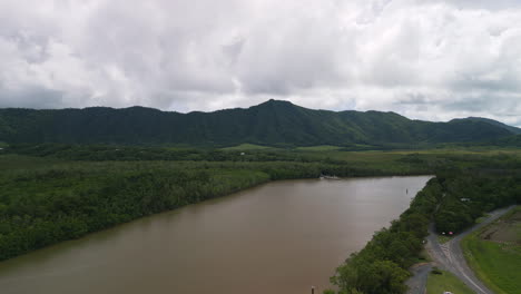 Panoramic-Aerial-landscape-at-Queensland-Daintree-River-Natural-Reserve-brown-water-canal-forest-environment,-green-area