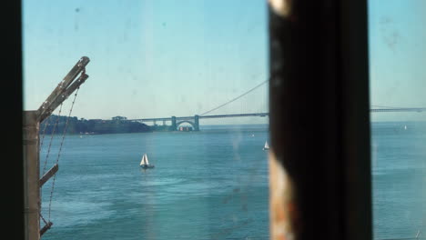 Alcatraz-Prison,-View-of-Golden-Gate-Bridge-and-San-Francisco-Bay-From-Window-With-Metal-Bars