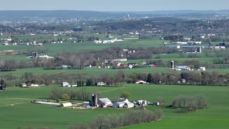 Rural-Landscape-of-USA-with-farmland,-silo-storage-and-stable