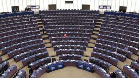 Time-lapse-of-politicians-arriving-in-the-European-Parliament-hemicycle-during-the-plenary-session-in-Strasbourg,-France