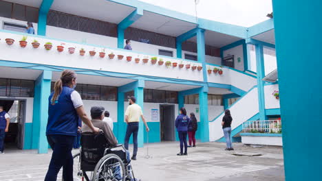 general-moving-shot-of-disabled-people-voting