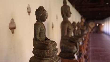 Ancient-buddha-statue-on-the-interior-of-Pha-That-Luang-Golden-Stupa-Buddhist-Temple-in-Vientiane,-Laos