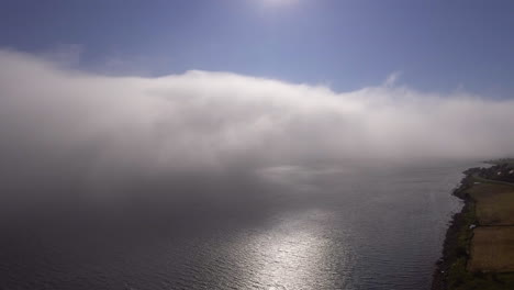 Aerial-of-clouds-drifting-over-a-fjord