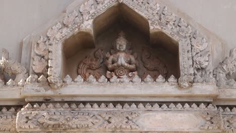 Detailed-carving-on-the-top-of-the-archway-of-Patuxai-Victory-Monument-in-the-center-of-Vientiane,-Laos