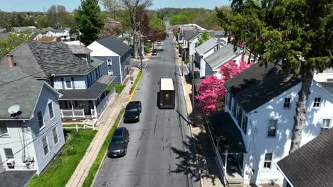 Brown-Truck-of-United-Parcel-Service-delivery-package-in-quaint-american-neighborhood