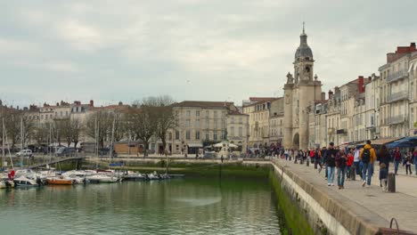 Shot-of-Vieux-Port,-which-is-situated-in-La-Rochelle,-an-old-harbor-along-the-western-coast-of-France-on-a-cloudy-day