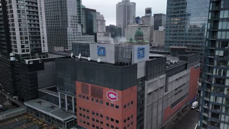 Bell-Centre-drone-descending,-multi-purpose-arena-in-downtown-Montreal