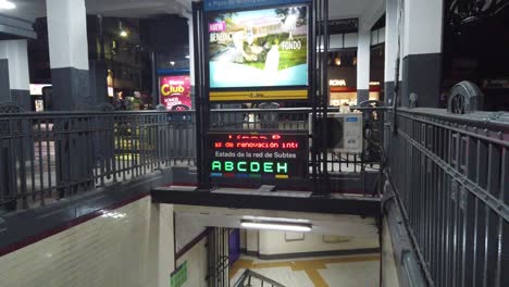 City-lights-flashing-at-staircase-entrance,-Buenos-Aires-Underground-Historic-Tramway-vintage-architecture-in-South-America