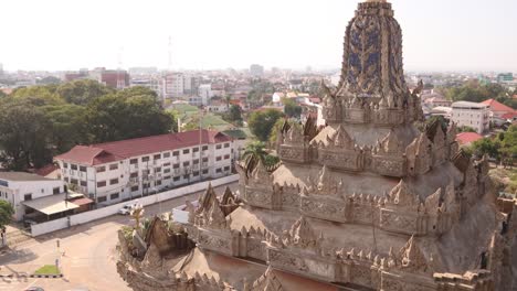Detailed-carved-spires-on-top-of-the-Patuxai-Victory-Monument-in-the-center-of-Vientiane,-Laos