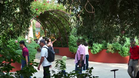 People-walking-into-the-Mediterranean-Garden-in-the-world-largest-glass-greenhouse-Flower-Dome-conservatory-at-Gardens-by-the-bay,-static-shot