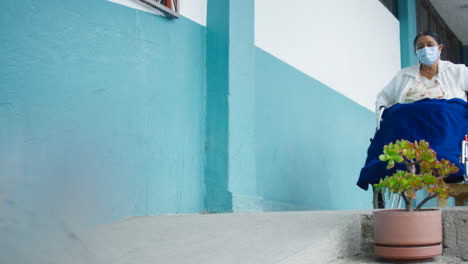 general-shot-of-elderly-woman-in-wheelchair-getting-around