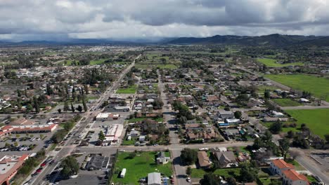 Aerial-view-of-Murrieta,-California:-a-picturesque-scene-capturing-residential-homes,-suburban-life,-and-distant-mountains,-showcasing-the-beauty-of-suburban-living-amidst-natural-landscapes