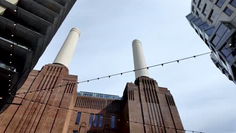 Looking-Up-At-Famous-Chimney-Towers-At-Battersea-Power-Station-In-London,-UK---Low-Angle