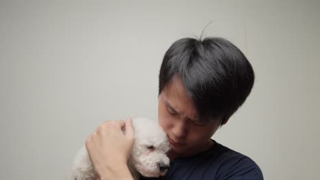 Chinese-Man-with-Toy-Poodle-companion.-white-background