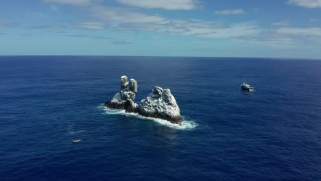 Roca-Partida-Split-rock-island-of-Revillagigedo-in-Mexico,-aerial-establishing-orbit