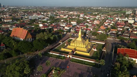 Aerial-drone-shot-of-Pha-That-Luang-Golden-Stupa-in-Vientiane,-Laos