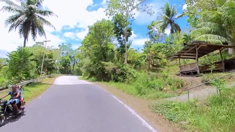 Drive-through-the-lush,-green-roads-of-Bohol's-interior-in-the-Philippines,-capturing-the-tranquil-beauty-of-the-countryside