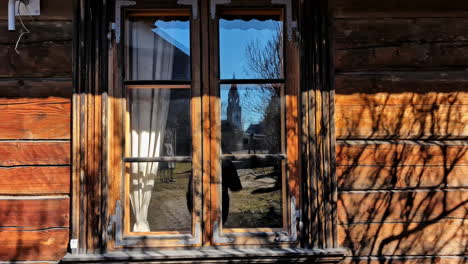 Shadow-Reflections-On-The-Vintage-Walls-Of-A-Wooden-Cabin