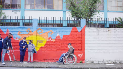 wide-shot-of-disabled-people-in-line-with-distance