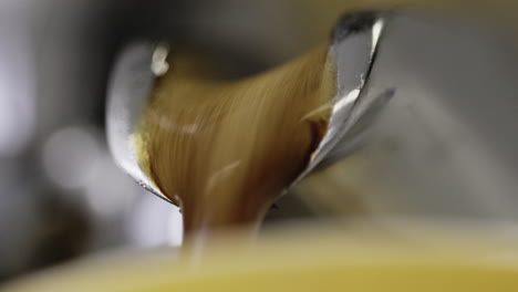 Macro-shot-of-an-espresso-being-pulled-out-of-a-machine