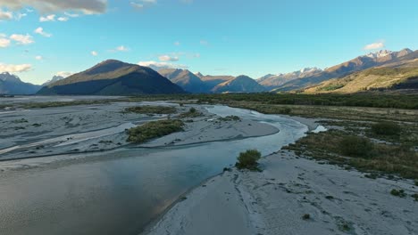 Aerial-pullback-above-river-delta-sweeping-across-low-lands-of-Glenorchy