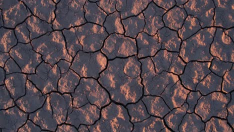 Top-Down-View-of-Dry-Desert-Land,-Cracked-Soil-Patterns-After-Drought