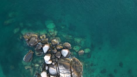 Looking-down-at-turquoise-waters-from-drone-view-above