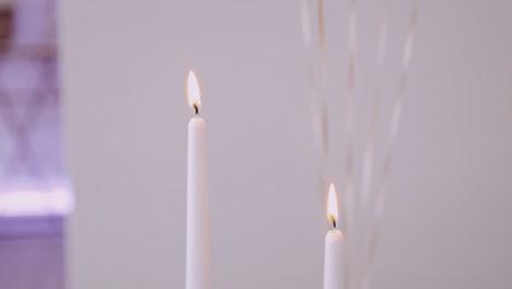 Soft-focus-on-tranquil-burning-candles,-ideal-for-spa-and-meditation-themes