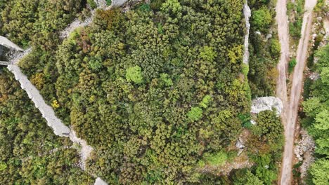 Aerial-View-of-the-Ruins-of-the-Ancient-Roman-Kadrema-Castle-Located-in-the-Gedelme-Village-and-Mountain-Ridge-on-Background