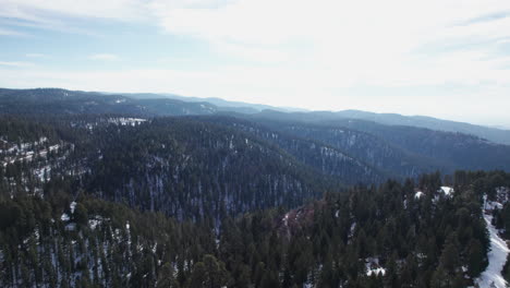 Aerial-view-flying-over-a-snow-covered-mountain-in-the-New-Mexico-Rocky-Mountains