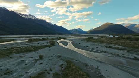 Sunlight-glistens-across-shallow-rivers-in-lowlands-of-Glenorchy-at-dusk