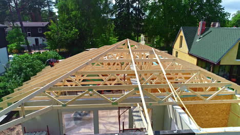 Flying-By-Residential-Building-Under-Construction-With-Timber-Trusses