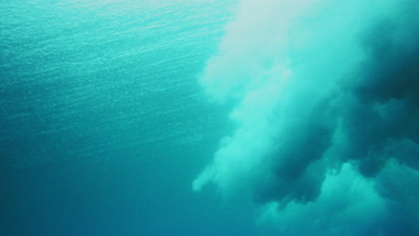 Ocean-spray-crashes-on-water-surface-with-vortex-trailing-behind