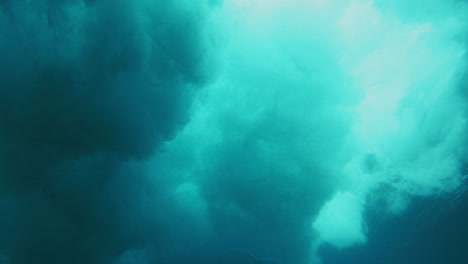 Stormy-water-sprays-across-ocean-surface-building-and-growing-underwater