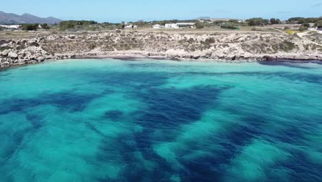 CALA-AZZURRA-FAVIGNANA-ISLAND-BLUE-BEACH-BY-DRONE